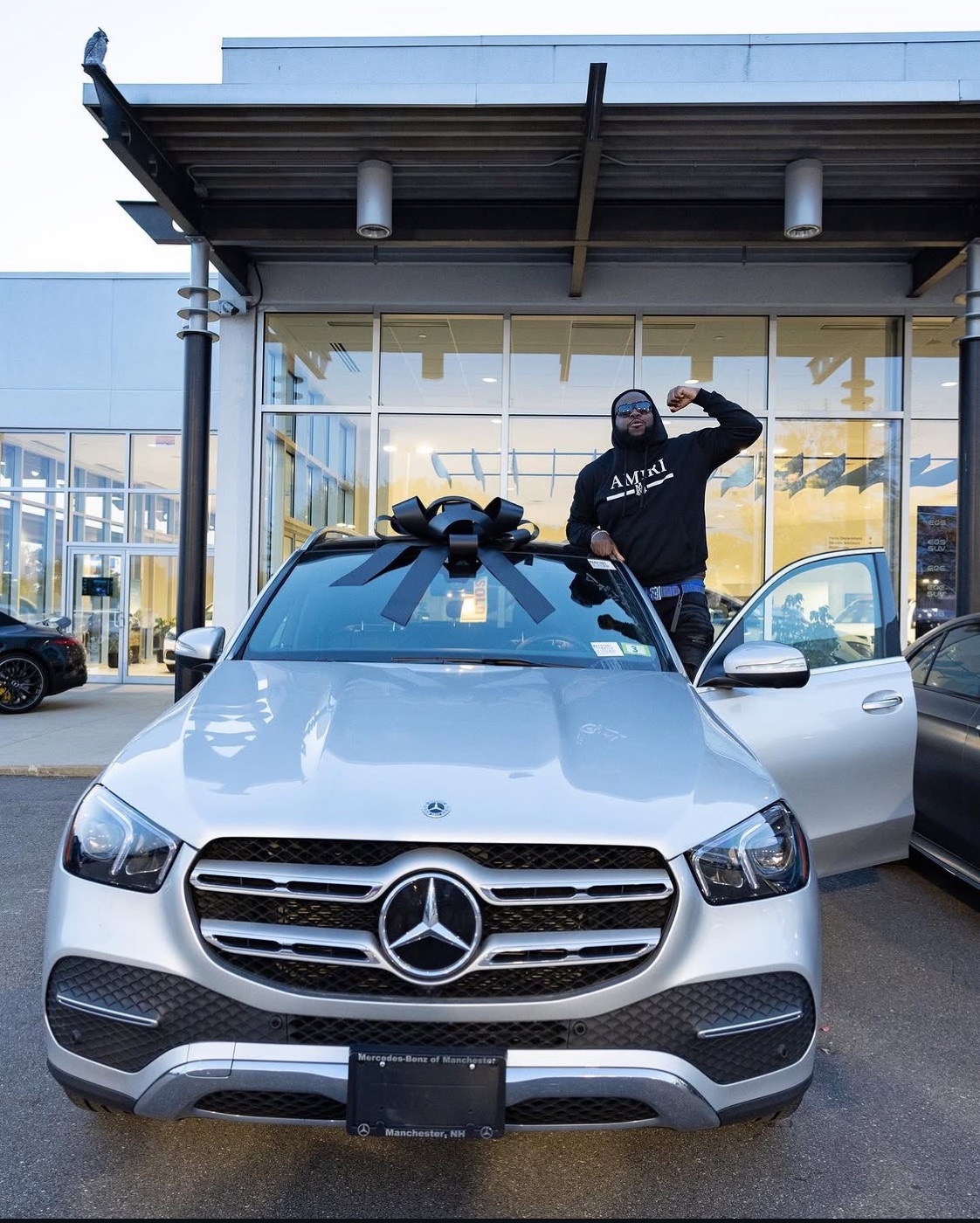 Cordell picking up his car from the dealership