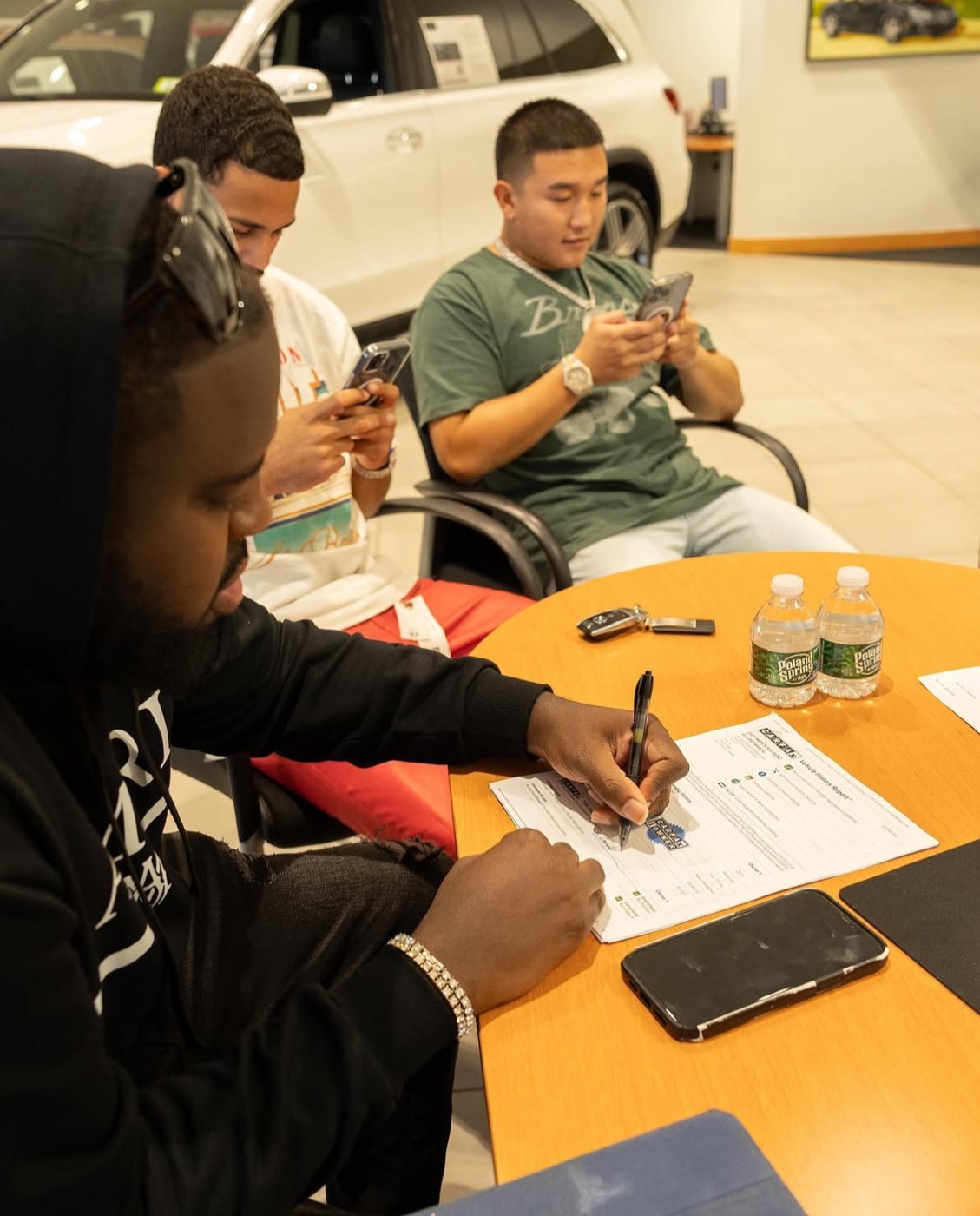 Signing the paperwork at the dealership